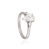 A breathtaking pear-shaped diamond embraced by shimmering side stones, creating a ring of effortless elegance.(PGDR0536)