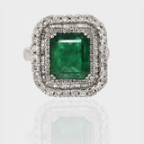 Ring, a dazzling fusion of timeless elegance and natural allure, featuring a captivating Colombian Emerald embraced by sparkling diamonds.(PGDR063)