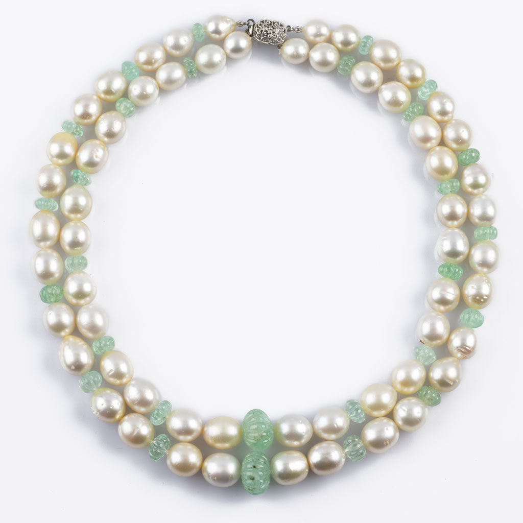 Two line necklace with emerald carved beads and south sea pearls with gold clasp STRG263