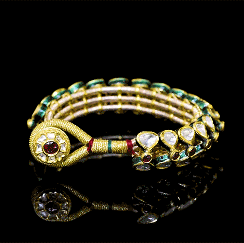Traditional handcrafted Pounchi Bangle featuring uncut polki stones, red gemstone accents. A perfect blend of cultural elegance and festive charm for any celebration.(KMB0595)