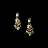 Elegant fusion-style necklace and earring pair featuring uncut diamond Polki, sparkling round diamonds, and subtle red enamel accents—perfectly blending traditional charm with modern sophistication for a standout look.(WDN1214)