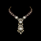 Elegant fusion-style necklace and earring pair featuring uncut diamond Polki, sparkling round diamonds, and subtle red enamel accents—perfectly blending traditional charm with modern sophistication for a standout look.(WDN1214)