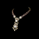 Elegant fusion-style necklace and earring pair featuring uncut diamond Polki, sparkling round diamonds, and subtle red enamel accents—perfectly blending traditional charm with modern sophistication for a standout look.(WDN1214)
