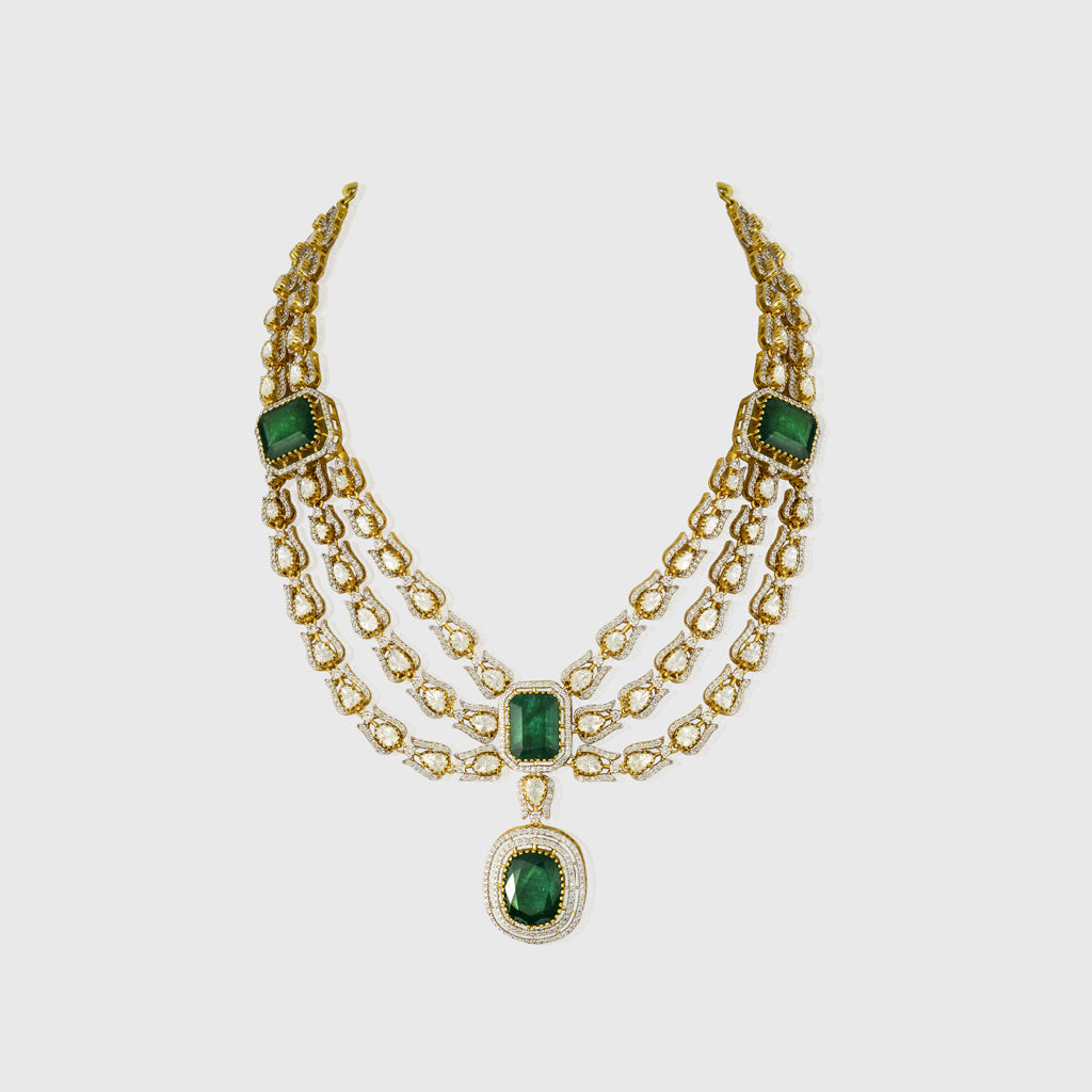 Elegant three-line fusion necklace featuring sparkling round diamonds and uncut diamond Polki, centered with a stunning octagon emerald—perfectly blending traditional artistry with modern sophistication for a captivating, timeless look.(WDN1218)