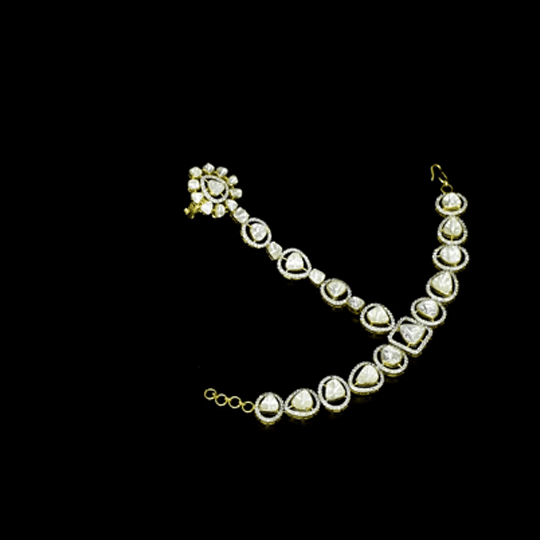 Traditional artistry meets contemporary brilliance in this elegant hathphool, featuring radiant diamond polki and shimmering round diamonds with timeless sophistication.(WDN1255)