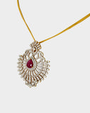 A stunning pendant with a vibrant pear ruby and round diamonds, offering classic elegance and luxurious, eye-catching charm.(WDN749)